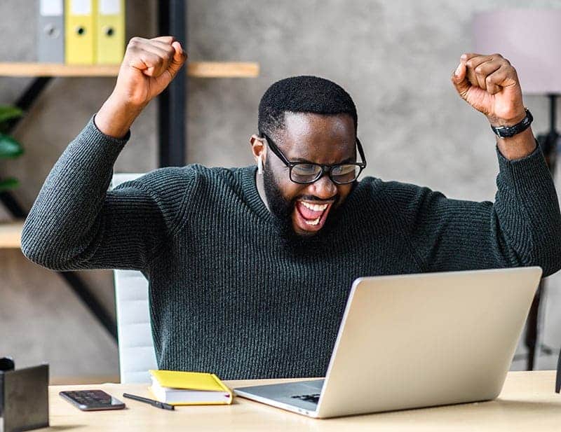 Person celebrated a successful Facebook Ad campaign.